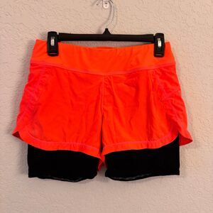 Athleta 2-in-1 Pulse Running Shorts Small Neon Orange Built-In Liner Zip Pocket